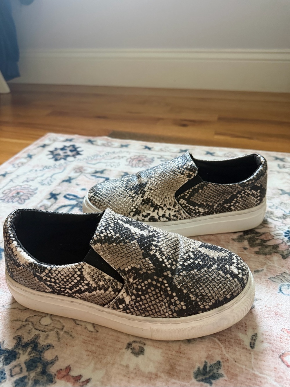 Snake print slip on shoes